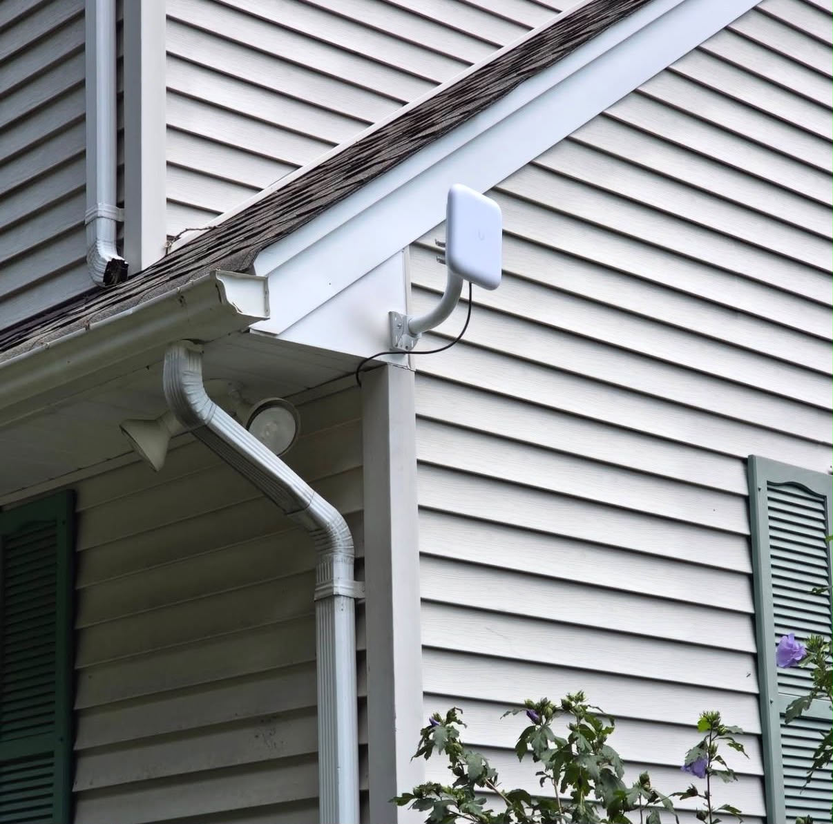 Network access point mounted under a roof eave
